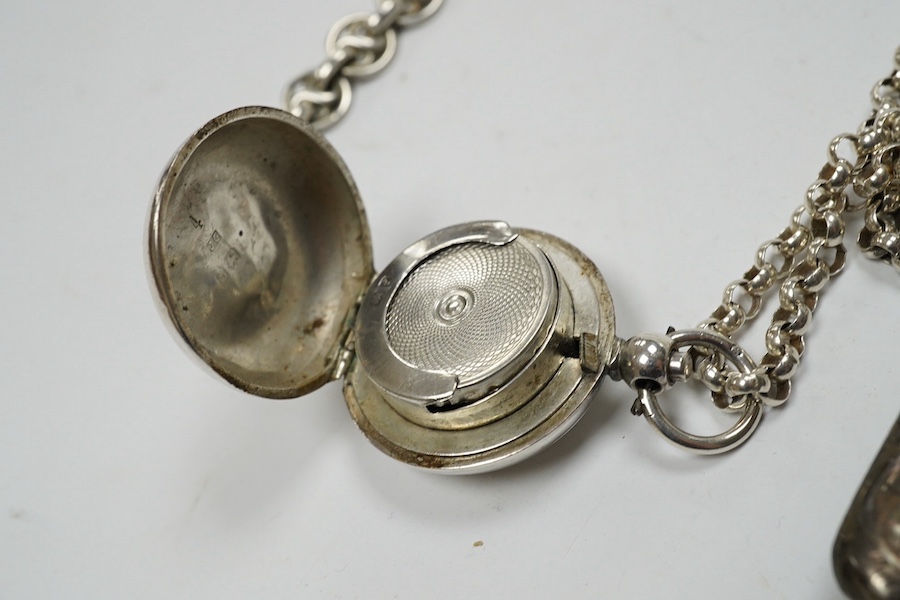 An Edwardian engraved silver sovereign case, Birmingham, 1905, on a silver chain, one other sterling chain, two silver vesta cases and a silver card case. Condition - poor to fair